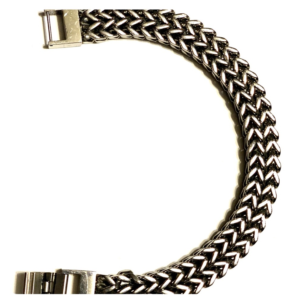 A silver and stainless steel Franco bracelet.